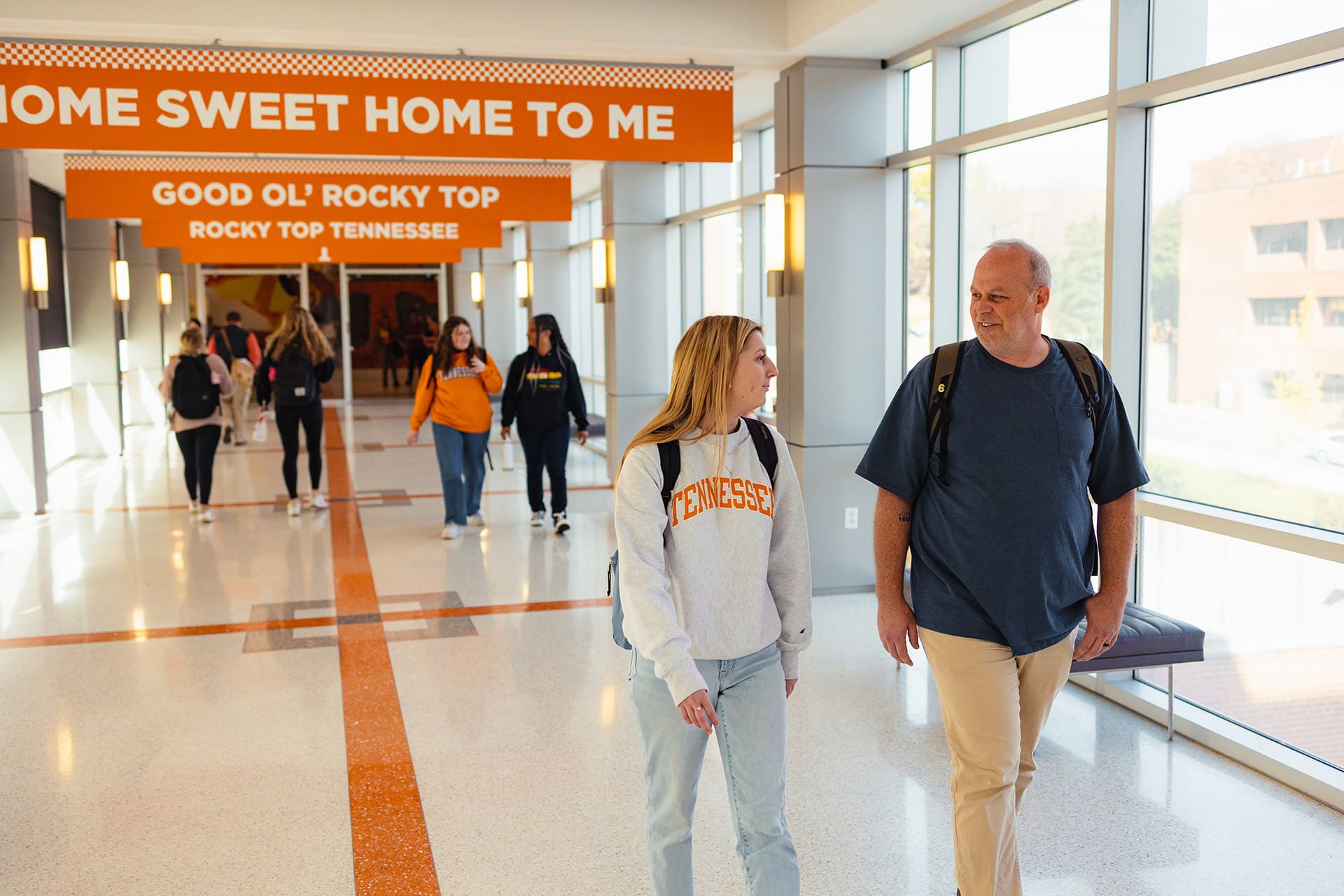 social work students walking on Rocky Top hallway bridge in university of tennessee student union