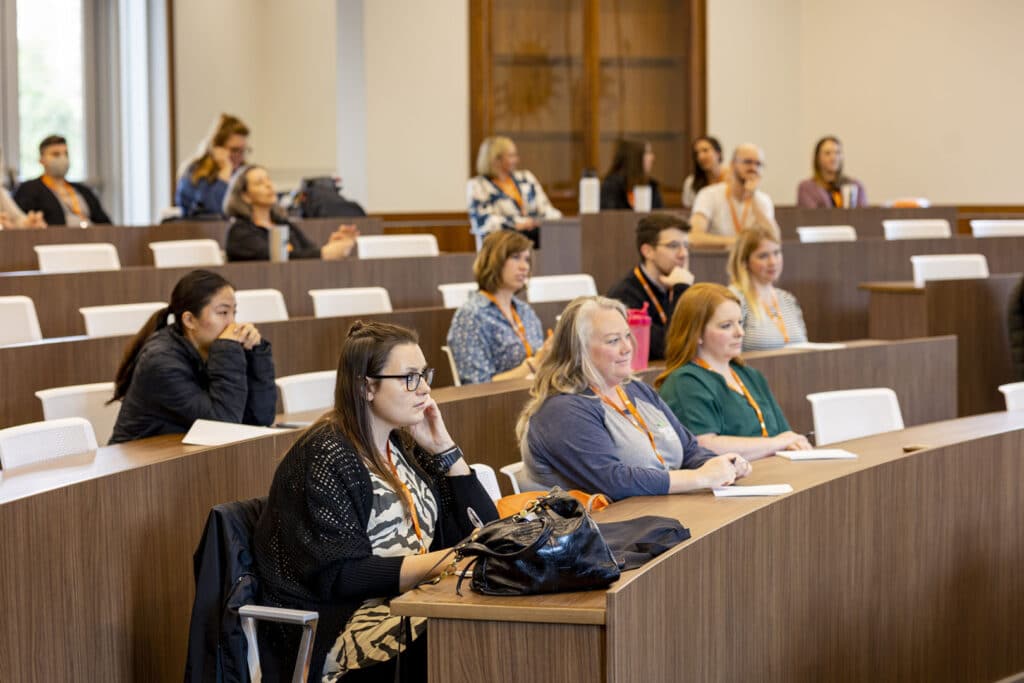 Group of folks sitting in a lecture hall