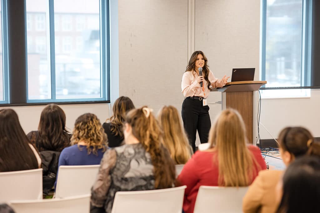 phd student eliza galvez teaching a continuing education session at the evolve conference 