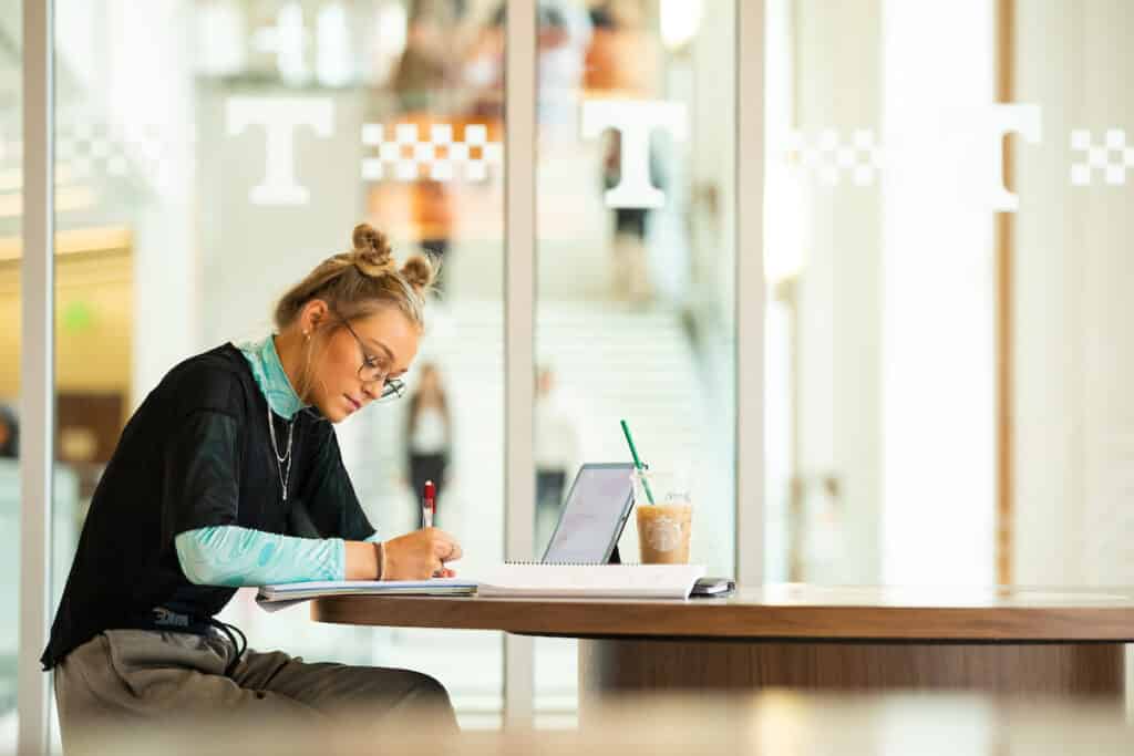 A student studies on an iPad in the first phase of the Student Union