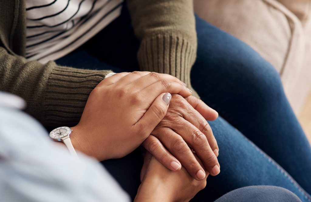 two people holding hands on top of leg