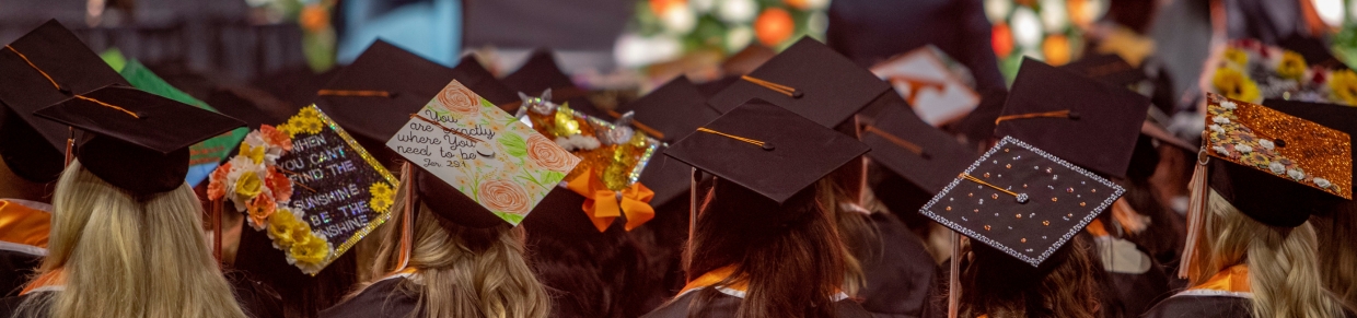 graduation caps in a row on heads