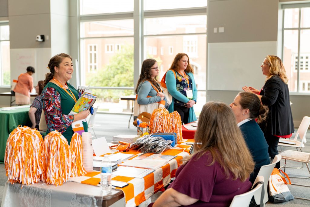 social work field workers talking at a table at a conference at University of tennessee